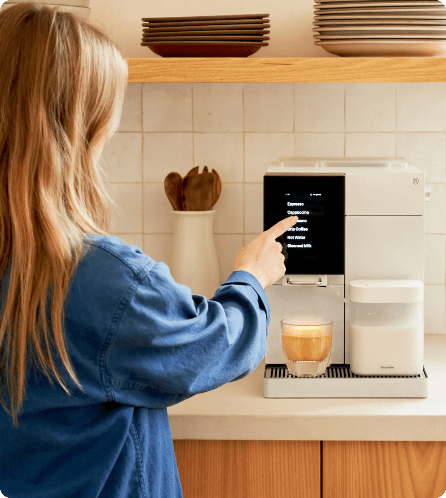 A customer choosing a monthly Whim option for a Terra Kaffe espresso machine