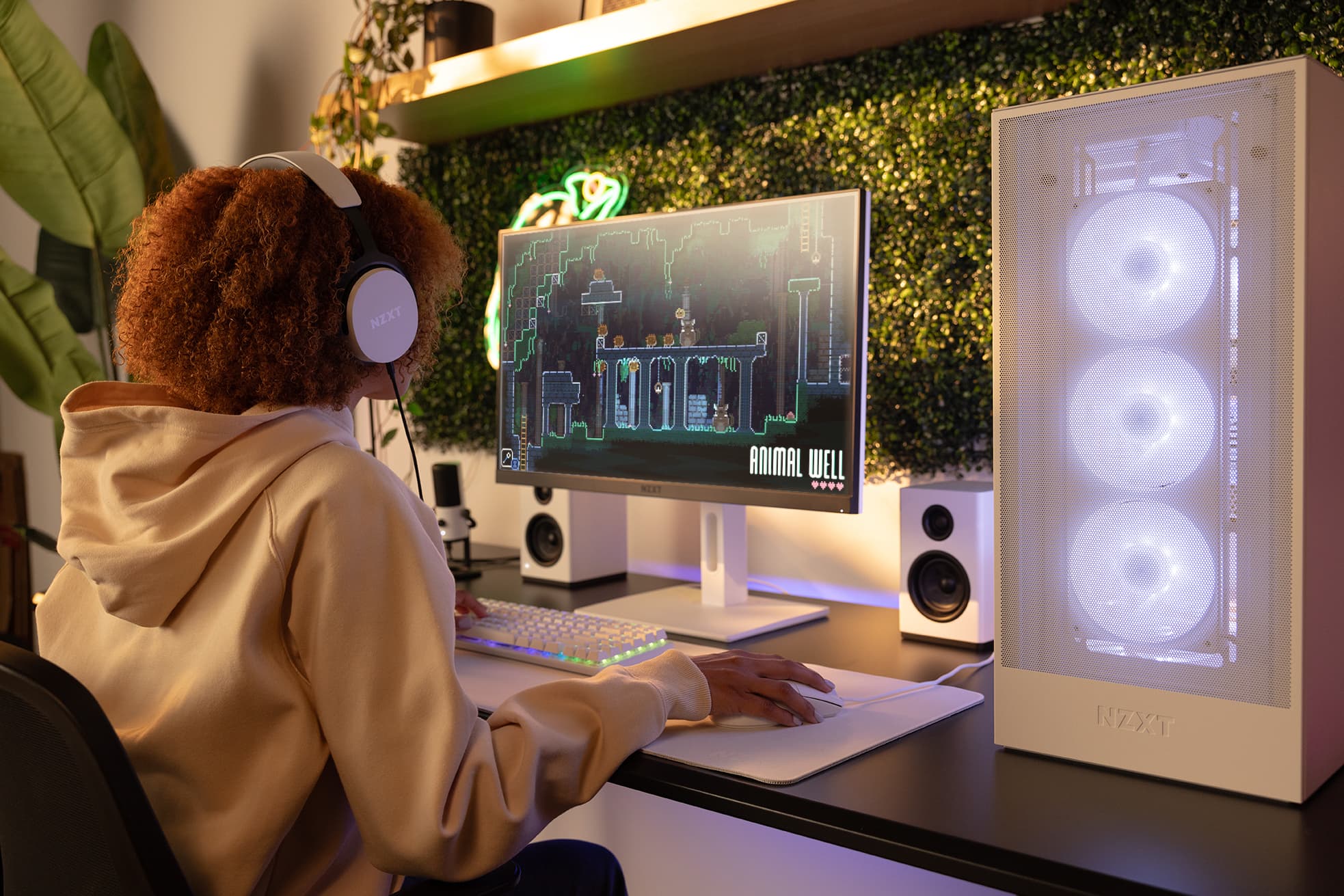 A person gaming on an NZXT desktop computer